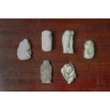 A GROUP OF SIX FIGURAL JADE CARVINGS