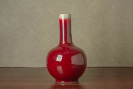 A SANG DE BOEUF BOTTLE VASE