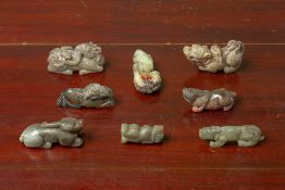 A GROUP OF EIGHT JADE CARVINGS OF MYTHICAL BEASTS