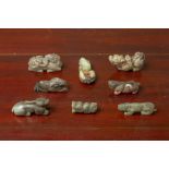 A GROUP OF EIGHT JADE CARVINGS OF MYTHICAL BEASTS