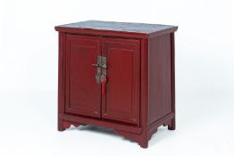 A CHINESE RED LACQUERED SIDE CABINET