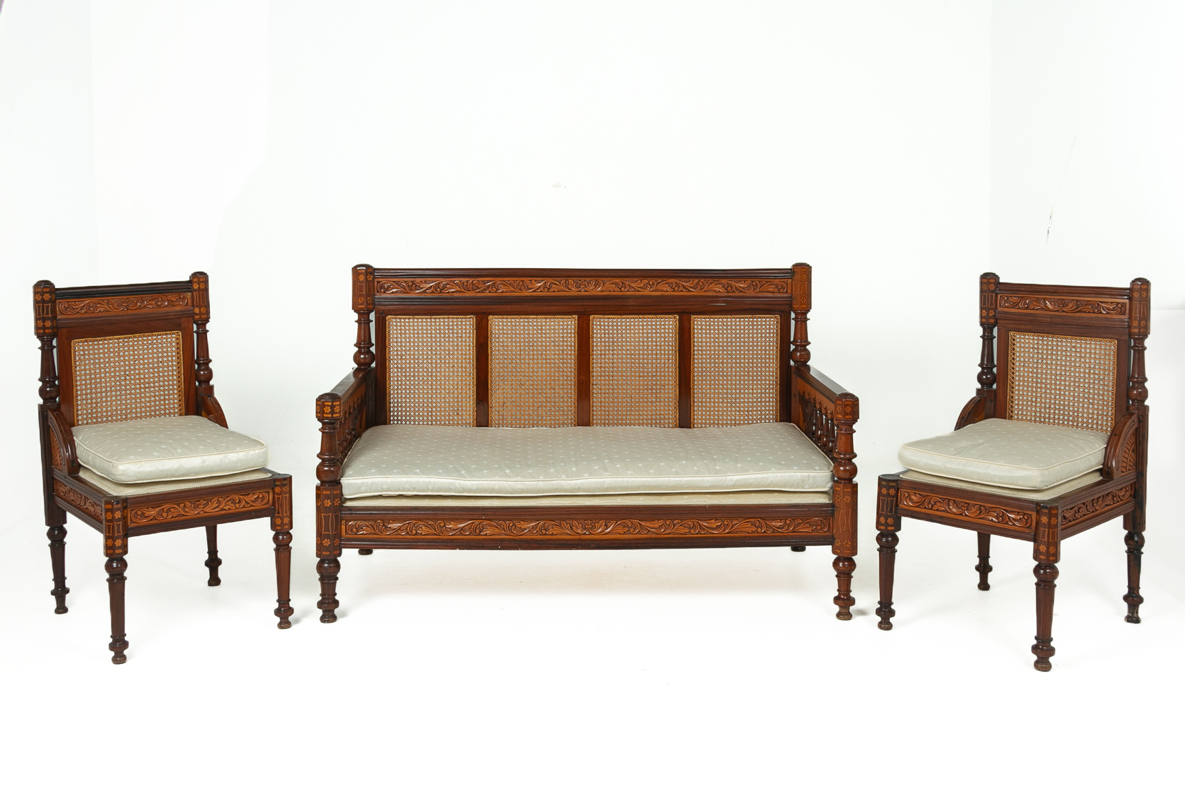 AN INDIAN CARVED ROSEWOOD THREE PIECE SOFA SET