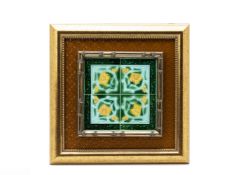 FOUR FRAMED GREEN GLAZED TILES