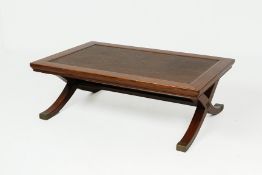 A JU WOOD AND RATTAN INSET COFFEE TABLE