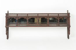 AN INDIAN CARVED WOOD WALL HANGING SHELF