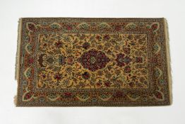 AN ORIENTAL WOOL CARPET