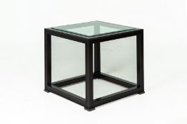 A GLAZED CUBIC SIDE TABLE