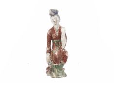 A CHINESE CARVED AND PAINTED WOOD FIGURE