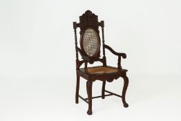 A PERANAKAN CARVED WOOD ARMCHAIR
