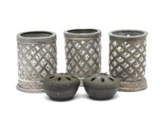 THREE METAL AND GLASS CANDLE HOLDERS