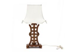 AN ORIENTAL CARVED WOOD TABLE LAMP