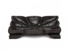 A LARGE RECTANGULAR CARVED WOOD DISH