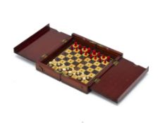 A 'WHITTINGTON' TYPE TRAVELLING CHESS SET