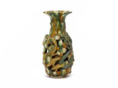 A SANCAI GLAZED RETICULATED DRAGON VASE