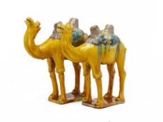 A PAIR OF SANCAI GLAZED MODELS OF CAMELS