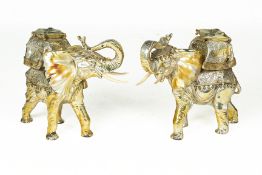 A PAIR OF DECORATIVE SILVERED MODELS OF ELEPHANTS