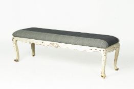 AN UPHOLSTERED WHITE PAINTED BENCH SEAT