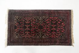 AN ORIENTAL CARPET