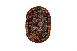 AN OVAL EMBROIDERED BEADED POUCH
