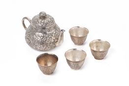 A SILVER TEAPOT AND FOUR TEABOWLS