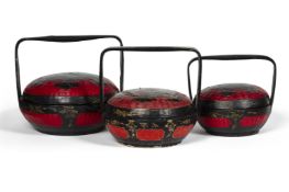 THREE BLACK AND RED LACQUERED BASKETS