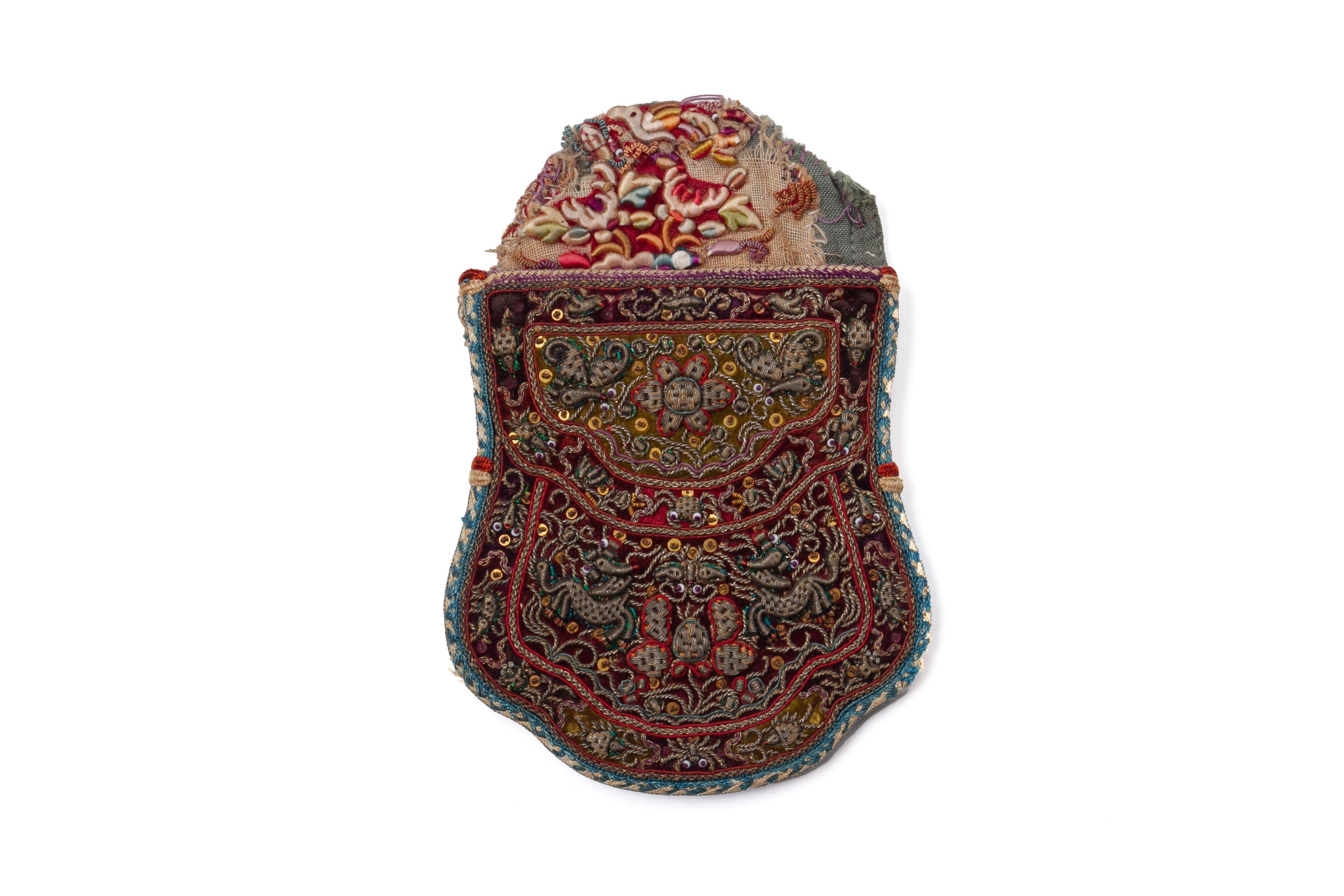 AN EMBROIDERED CEREMONIAL PURSE