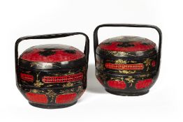 TWO BLACK AND RED LACQUERED BASKETS