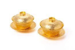 A PAIR OF SILVER GILT TEABOWLS, COVERS AND STANDS
