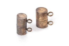 TWO SILVER TALISMAN HOLDERS