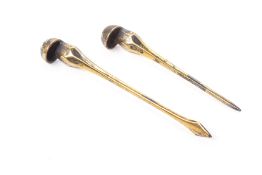 TWO SILVER GILT HAIRPINS