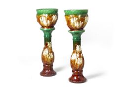 A PAIR OF GLAZED JARDINIERES ON STANDS