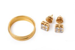 A PAIR OF DIAMOND STUD EARRINGS AND THREE GOLD BAND RINGS