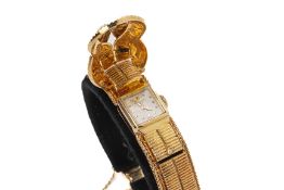 A SPRITZER & FUHRMANN MOVADO GOLD LADIES SURPRISE WATCH