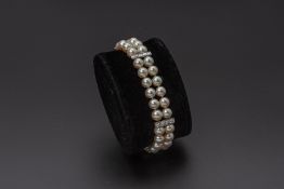 A CULTURED PEARL AND DIAMOND BRACELET