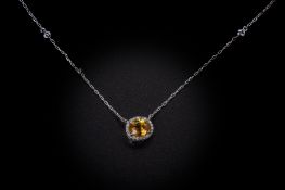 A YELLOW SAPPHIRE PENDANT NECKLACE