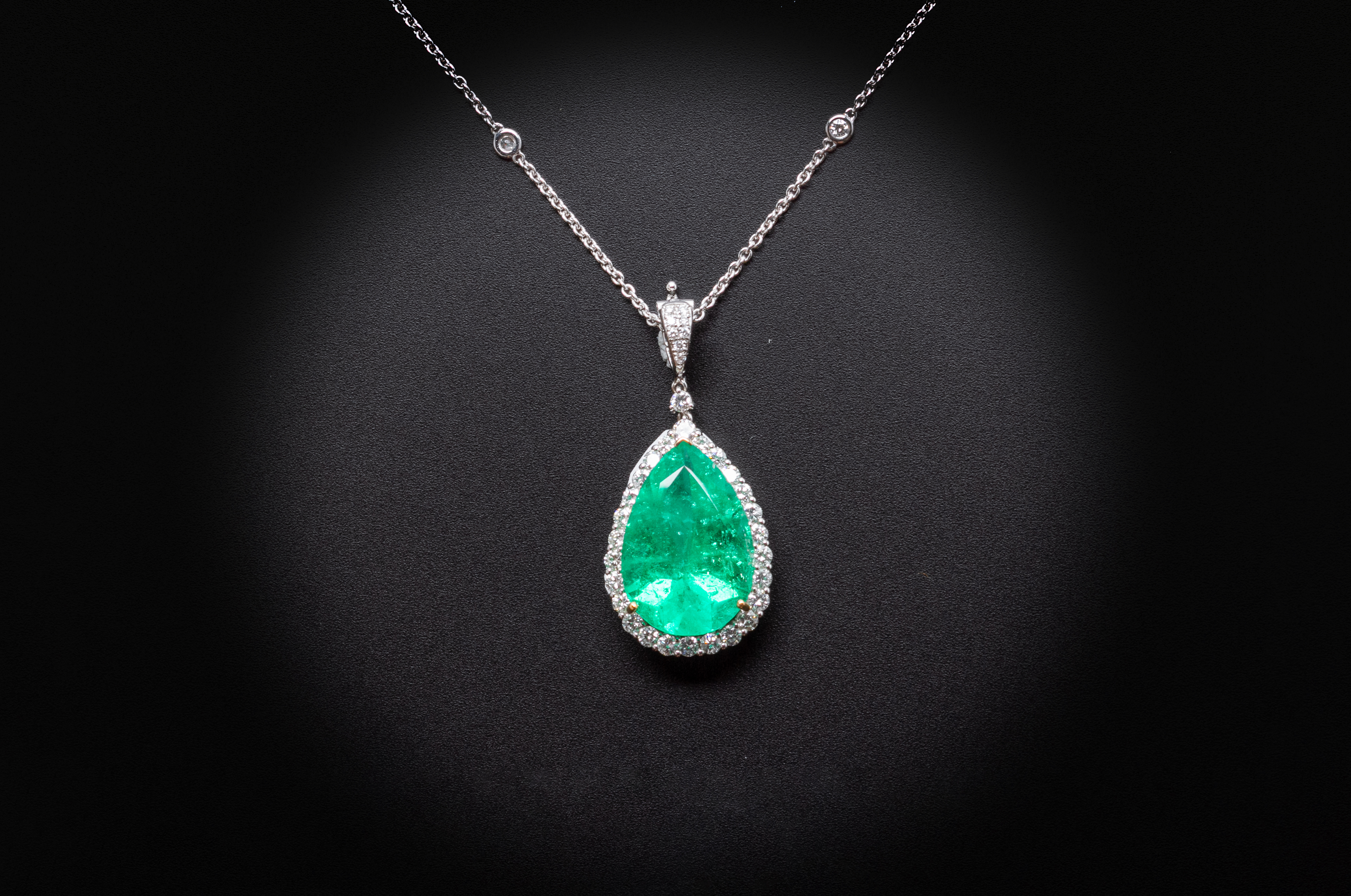 A LARGE EMERALD AND DIAMOND PENDANT