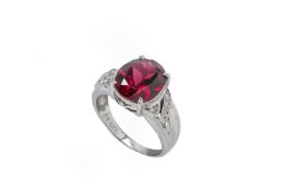 A GARNET AND DIAMOND RING