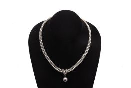 A DOUBLE STRAND AKOYA CULTURED PEARL NECKLACE WITH PENDANT