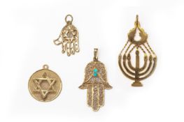 A GROUP OF FOUR GOLD PENDANTS