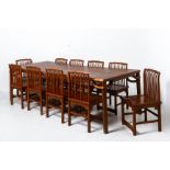 A LARGE ELM DINING TABLE AND TEN CHAIRS