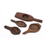 A GROUP OF FOUR WOODEN COOKING MOULDS