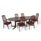 A DANISH ROSEWOOD EXTENDING DINING TABLE AND TEAK CHAIRS