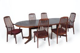 A DANISH ROSEWOOD EXTENDING DINING TABLE AND TEAK CHAIRS