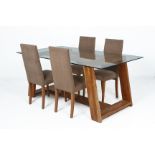 A GLASS TOPPED DINING TABLE AND FOUR CHAIRS
