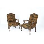 A PAIR OF UPHOLSTERED ARMCHAIRS