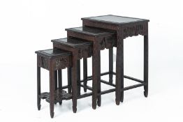 A CHINESE CARVED NEST OF FOUR TABLES