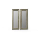 A PAIR OF METALWARE NARROW WALL MIRRORS