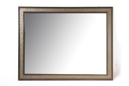 A LARGE FRAMED WALL MIRROR