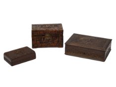 A GROUP OF THREE CARVED WOOD BOXES