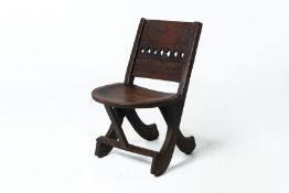 A TRIBAL CARVED WOOD CHAIR